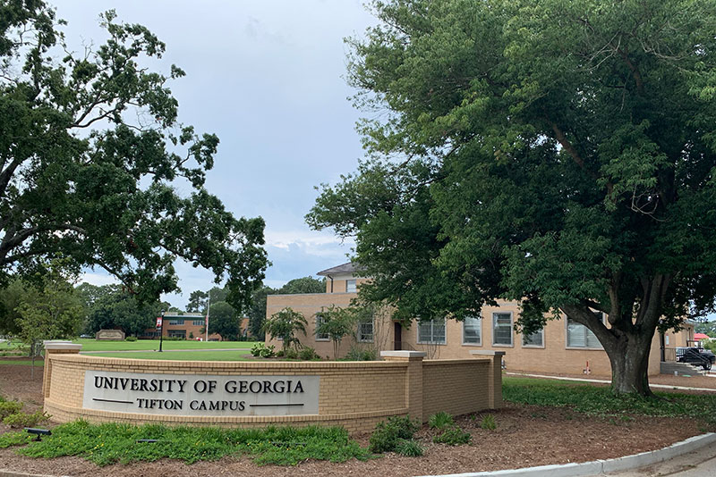 Image of UGA Tifton sign. The building in the background houses the Center for Invasive Species & Ecosystem Health.