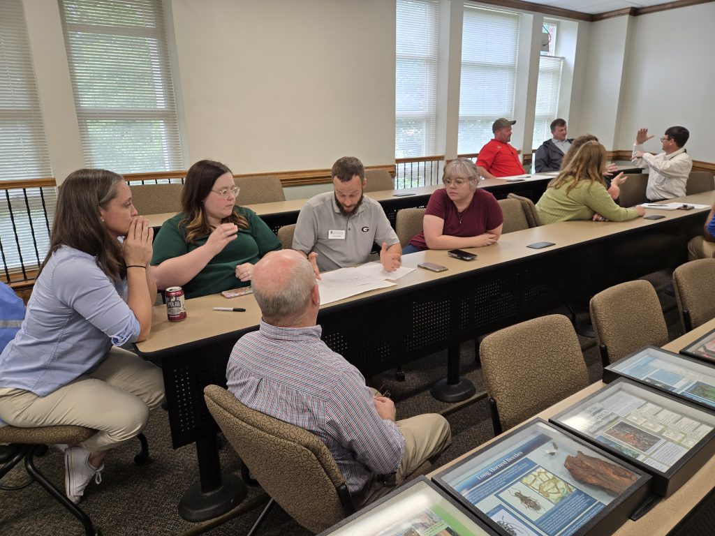People sitting at a table, talking.